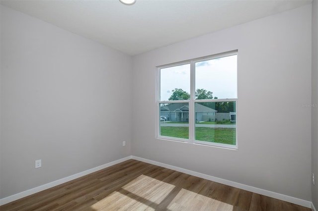 10207 SW 41st Ter W, Ocala, FL 34476 - empty room with dark wood-style flooring and baseboards