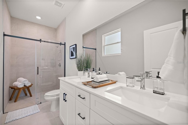 10207 SW 41st Ter W, Ocala, FL 34476 - bathroom featuring double vanity, a stall shower, tile patterned flooring, and recessed lighting