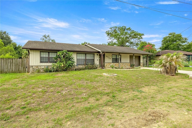 5720 SE 20th St, Ocala, FL 34480 - ranch-style house with stone siding, an attached garage, and concrete driveway