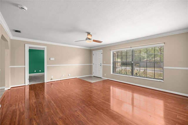5720 SE 20th St, Ocala, FL 34480 - empty room featuring ceiling fan, a smoke detector, a textured ceiling, ornamental molding, and baseboards