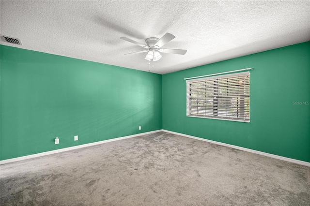 5720 SE 20th St, Ocala, FL 34480 - spare room featuring ceiling fan, carpet, a textured ceiling, and baseboards