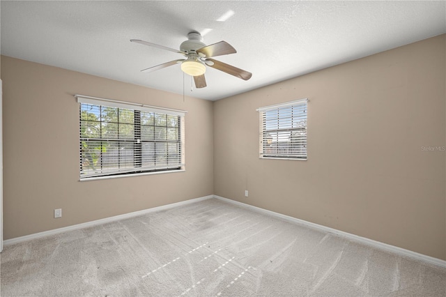5720 SE 20th St, Ocala, FL 34480 - spare room featuring ceiling fan, healthy amount of natural light, baseboards, and light colored carpet