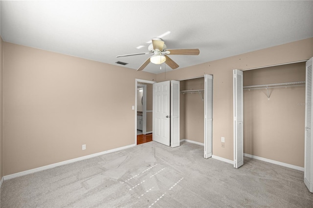 5720 SE 20th St, Ocala, FL 34480 - unfurnished bedroom featuring multiple closets, carpet, baseboards, and ceiling fan