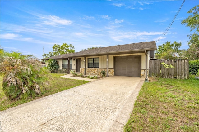 5720 SE 20th St, Ocala, FL 34480 - ranch-style house with an attached garage, concrete driveway, and stone siding