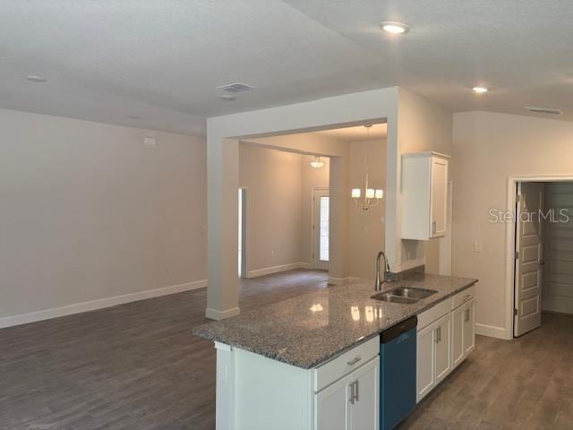 7637 SW 180th Cir, Dunnellon, FL 34432 - kitchen featuring a sink, dishwashing machine, dark wood-style floors, open floor plan, and white cabinetry