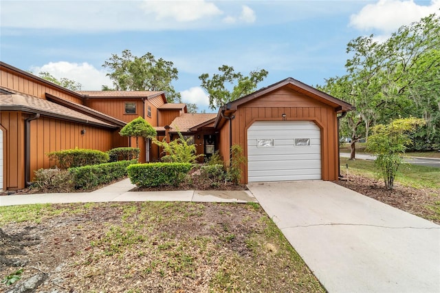 2701 NE 10th St Unit 101, Ocala, FL 34470 - view of front facade featuring driveway and an attached garage
