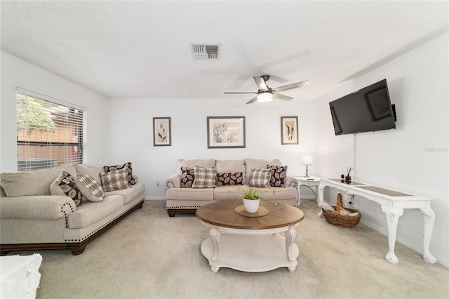 2701 NE 10th St Unit 101, Ocala, FL 34470 - living area with carpet, ceiling fan, and baseboards
