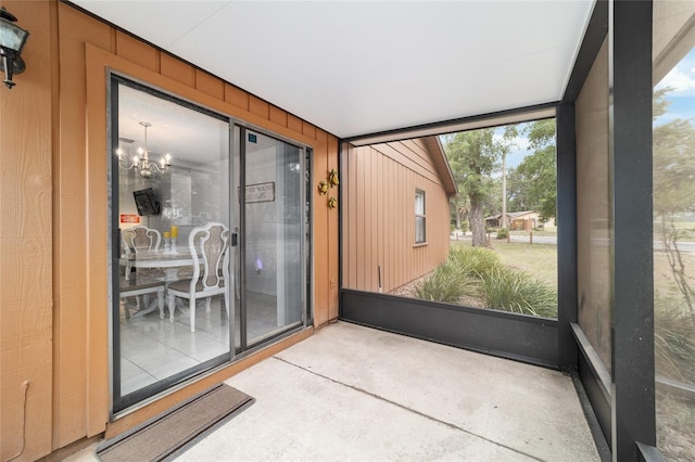 2701 NE 10th St Unit 101, Ocala, FL 34470 - sunroom / solarium featuring a chandelier