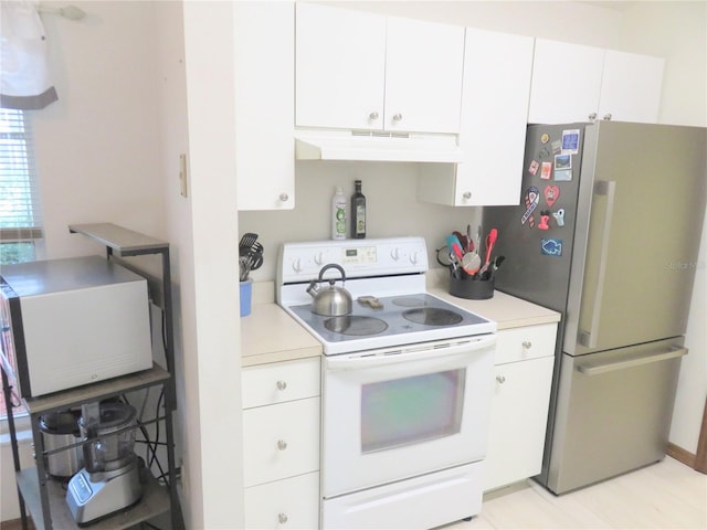 5083 SE 26th St, Ocala, FL 34480 - kitchen featuring white appliances, under cabinet range hood, light countertops, and white cabinets