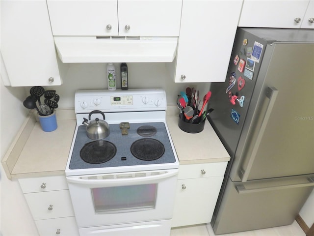 5083 SE 26th St, Ocala, FL 34480 - kitchen with freestanding refrigerator, white range with electric stovetop, light countertops, white cabinets, and exhaust hood