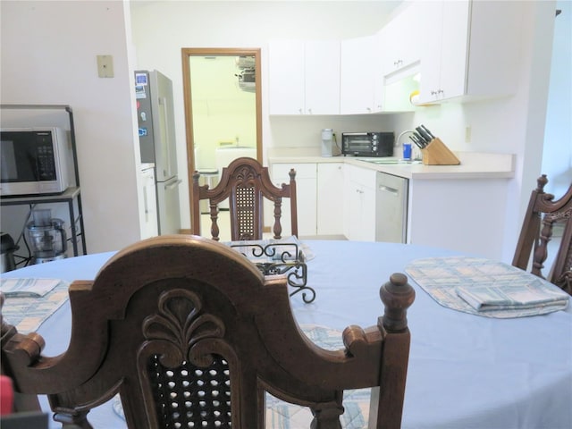 5083 SE 26th St, Ocala, FL 34480 - dining space featuring washer / dryer