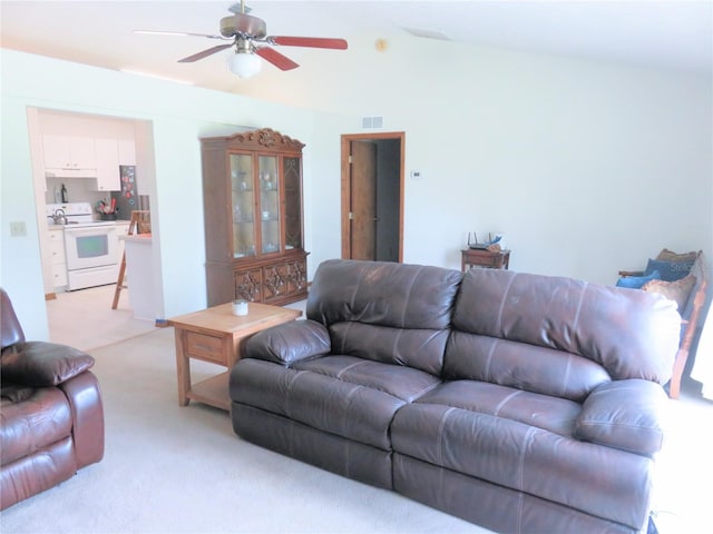5083 SE 26th St, Ocala, FL 34480 - living area featuring light colored carpet, ceiling fan, and lofted ceiling