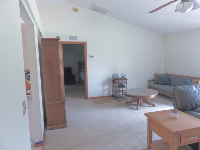 5083 SE 26th St, Ocala, FL 34480 - carpeted living room featuring a ceiling fan, vaulted ceiling, and baseboards