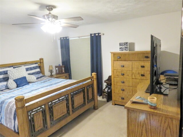 5083 SE 26th St, Ocala, FL 34480 - bedroom with light carpet and ceiling fan
