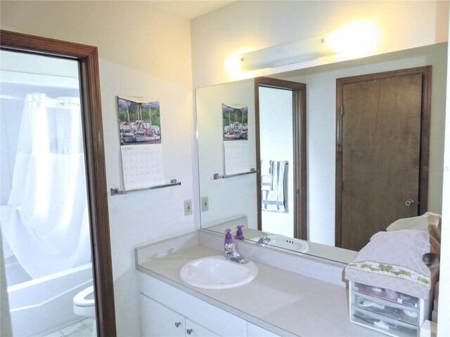 5083 SE 26th St, Ocala, FL 34480 - bathroom with vanity, toilet, and shower / bath combination with curtain