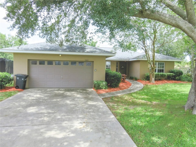 5083 SE 26th St, Ocala, FL 34480 - single story home featuring a garage, stucco siding, concrete driveway, and a front lawn