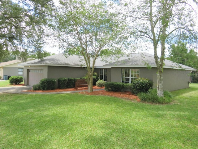 5083 SE 26th St, Ocala, FL 34480 - ranch-style house featuring an attached garage, stucco siding, a front lawn, concrete driveway, and a shingled roof