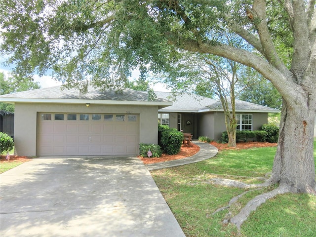 5083 SE 26th St, Ocala, FL 34480 - single story home featuring stucco siding, an attached garage, concrete driveway, and a front lawn