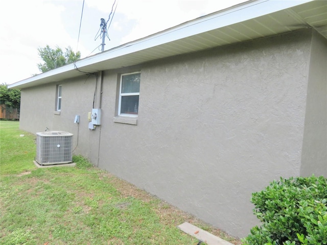 5083 SE 26th St, Ocala, FL 34480 - view of home's exterior featuring stucco siding and a yard