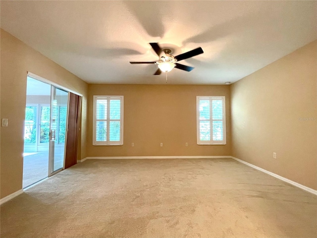 16405 SW 14th Avenue Rd, Ocala, FL 34473 - empty room with baseboards, ceiling fan, and carpet flooring