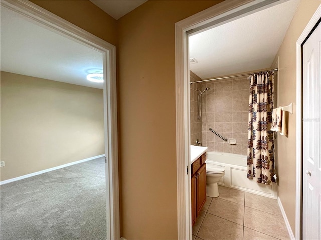 16405 SW 14th Avenue Rd, Ocala, FL 34473 - bathroom featuring shower / bath combo, vanity, toilet, tile patterned flooring, and baseboards