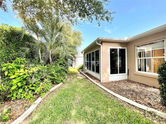 16405 SW 14th Avenue Rd, Ocala, FL 34473 - view of green lawn featuring a sunroom