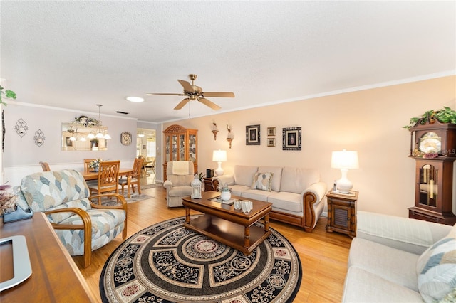 8420 SW 93rd Ln Unit E, Ocala, FL 34476 - living area with ornamental molding, ceiling fan, light wood-type flooring, a textured ceiling, and recessed lighting