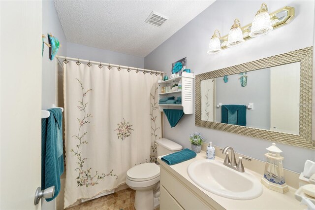 8420 SW 93rd Ln Unit E, Ocala, FL 34476 - bathroom with vanity, toilet, a textured ceiling, and a shower with shower curtain
