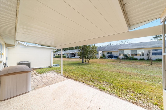 8420 SW 93rd Ln Unit E, Ocala, FL 34476 - view of patio featuring central AC unit, a carport, and a residential view