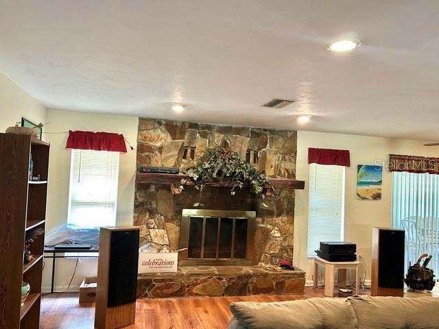 20100 SW 95th St, Dunnellon, FL 34431 - living room with wood finished floors and a stone fireplace