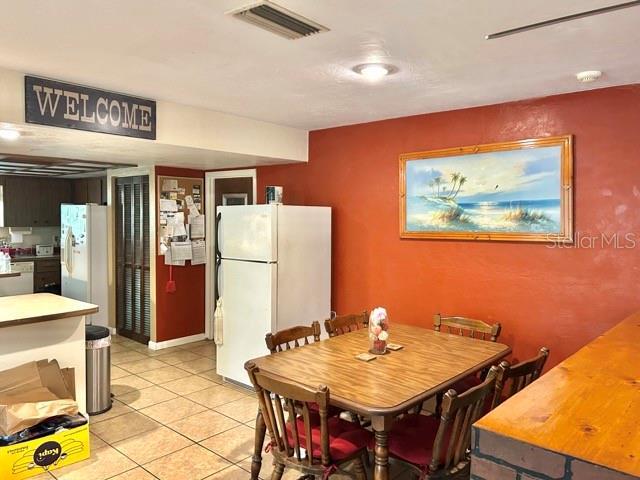 20100 SW 95th St, Dunnellon, FL 34431 - dining space featuring light tile patterned flooring