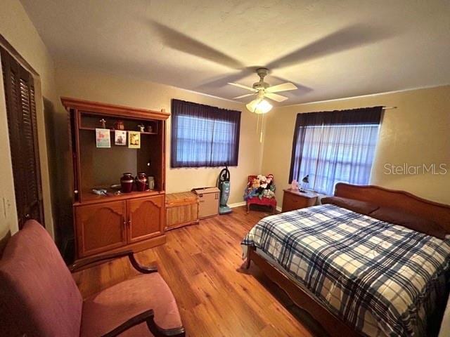 20100 SW 95th St, Dunnellon, FL 34431 - bedroom featuring light wood finished floors, a ceiling fan, and baseboards