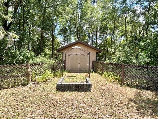 20100 SW 95th St, Dunnellon, FL 34431 - view of shed featuring a fenced backyard
