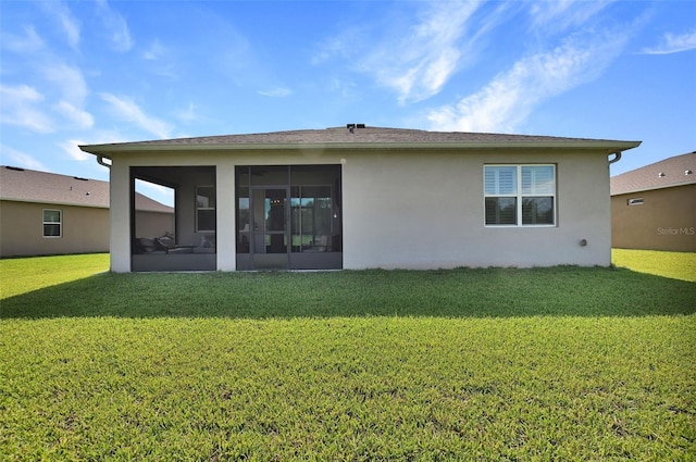 6405 SW 88th Loop, Ocala, FL 34476 - back of house with a sunroom, a yard, and stucco siding