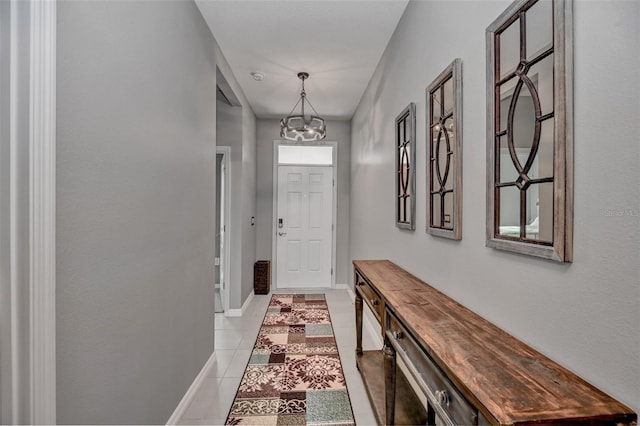 6405 SW 88th Loop, Ocala, FL 34476 - doorway to outside with a chandelier and light tile patterned floors