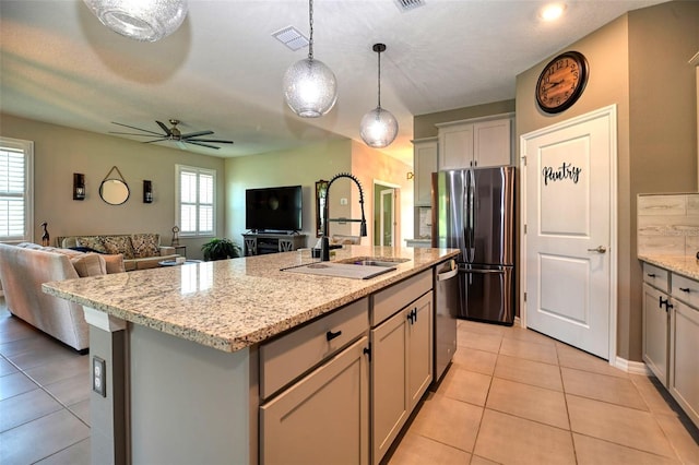 6405 SW 88th Loop, Ocala, FL 34476 - kitchen featuring appliances with stainless steel finishes, light tile patterned floors, open floor plan, an island with sink, and ceiling fan