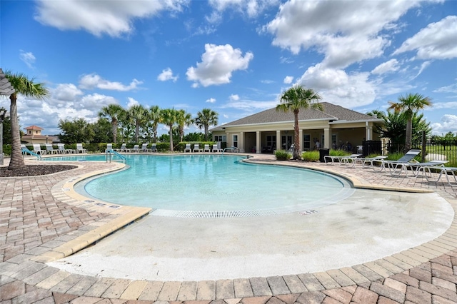 6405 SW 88th Loop, Ocala, FL 34476 - community pool with a patio