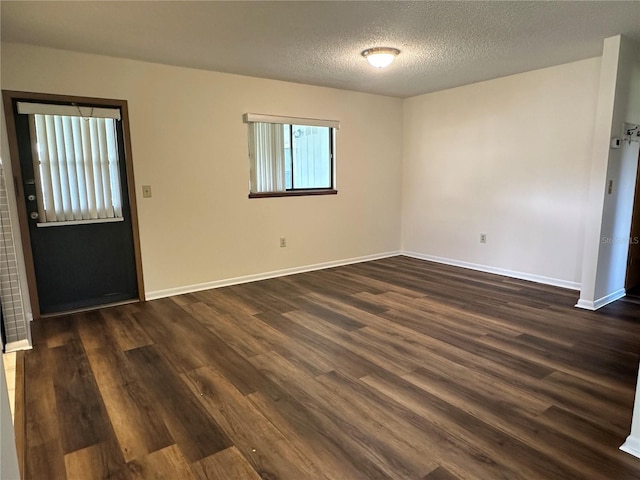 10080 SW 97th Ct, Ocala, FL 34481 - spare room with dark wood-style flooring, baseboards, and a textured ceiling