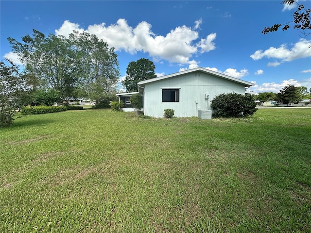 10080 SW 97th Ct, Ocala, FL 34481 - view of side of home with a yard and central AC unit