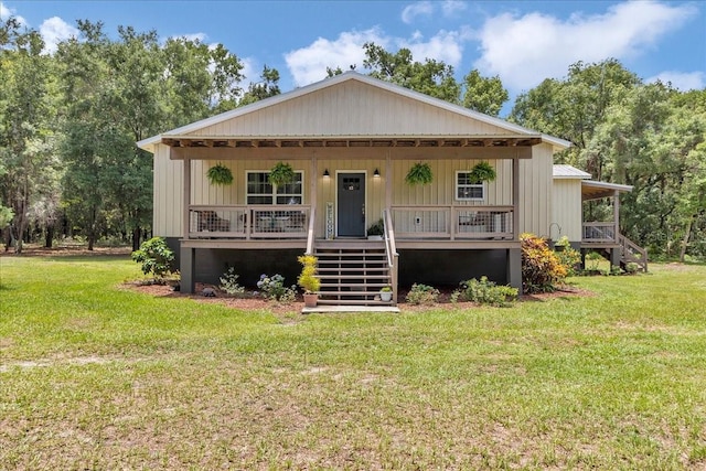 12080 SE Sunset Harbor Rd, Weirsdale, FL 32195 - view of front of home with stairs, a porch, and a front yard
