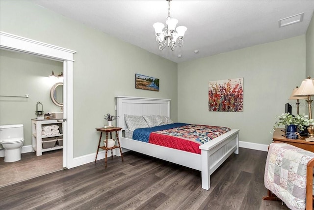 12080 SE Sunset Harbor Rd, Weirsdale, FL 32195 - bedroom featuring wood finished floors, a chandelier, and ensuite bathroom