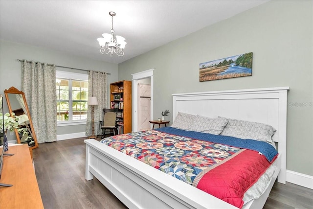 12080 SE Sunset Harbor Rd, Weirsdale, FL 32195 - bedroom with wood finished floors and a chandelier