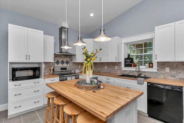 12080 SE Sunset Harbor Rd, Weirsdale, FL 32195 - kitchen featuring black appliances, wall chimney range hood, wood counters, light tile patterned floors, and vaulted ceiling