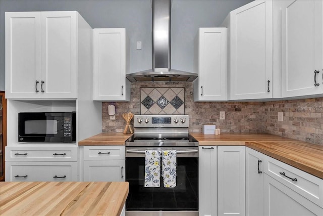 12080 SE Sunset Harbor Rd, Weirsdale, FL 32195 - kitchen with butcher block counters, electric range, wall chimney range hood, black microwave, and backsplash