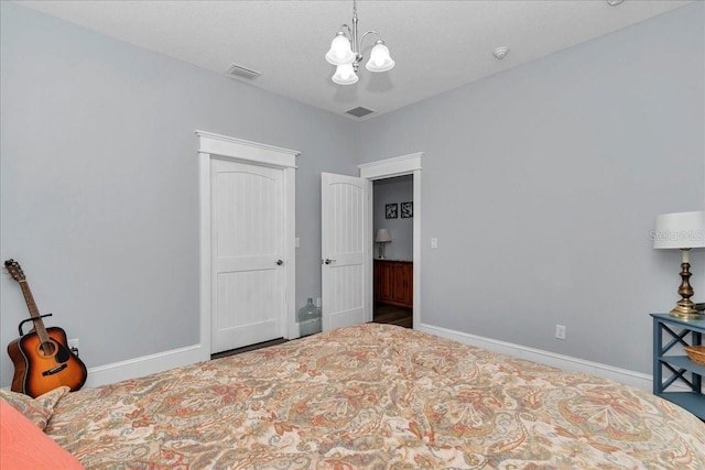 12080 SE Sunset Harbor Rd, Weirsdale, FL 32195 - bedroom with a chandelier and a closet