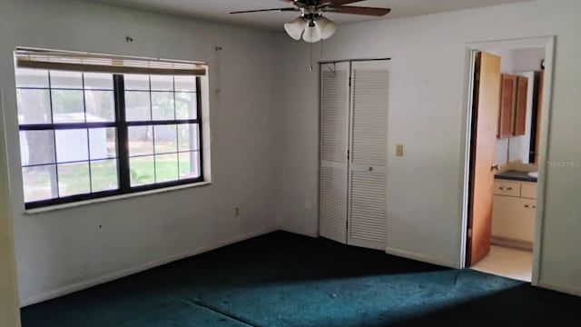 8485 E Hampton Point Rd, Inverness, FL 34450 - unfurnished bedroom featuring carpet floors, a closet, connected bathroom, baseboards, and ceiling fan