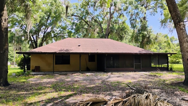 8485 E Hampton Point Rd, Inverness, FL 34450 - back of property featuring a sunroom