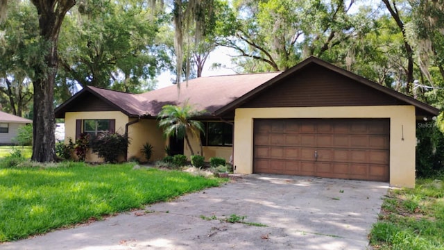 8485 E Hampton Point Rd, Inverness, FL 34450 - ranch-style home featuring stucco siding, a garage, and driveway