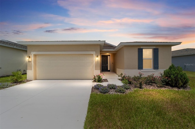 5842 SW 78th Avenue Rd, Ocala, FL 34474 - view of front of house with stucco siding, an attached garage, driveway, and a front yard