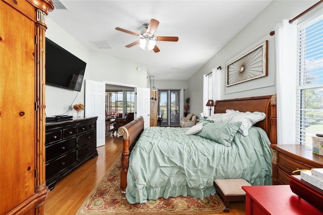 8737 SW 83rd Cir, Ocala, FL 34481 - bedroom with wood finished floors, access to outside, french doors, and ceiling fan